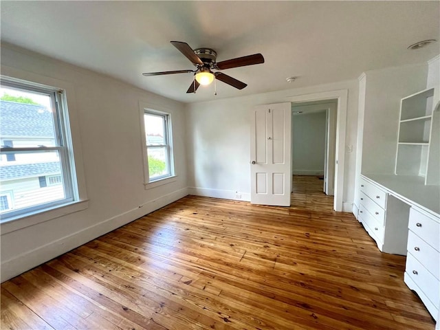 808 Center St, Horseheads, NY 14845 - unfurnished bedroom featuring hardwood / wood-style flooring, baseboards, and a ceiling fan