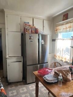56 Blake St, Buffalo, NY 14211 - kitchen with freestanding refrigerator, white cabinetry, and light floors