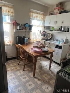56 Blake St, Buffalo, NY 14211 - kitchen with healthy amount of natural light, light flooring, and white cabinetry