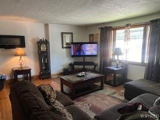 56 Blake St, Buffalo, NY 14211 - living area featuring a textured ceiling, wood finished floors, and baseboards