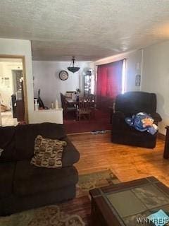 56 Blake St, Buffalo, NY 14211 - living room with a textured ceiling and wood finished floors
