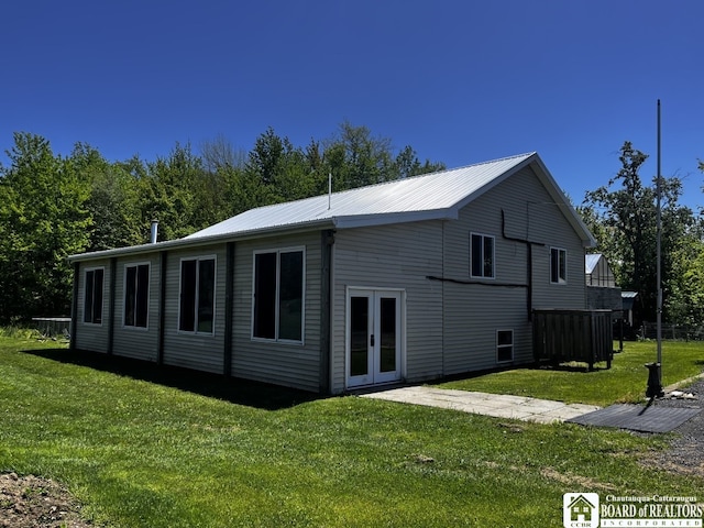 11604 York Rd, Hanover, NY 14136 - back of house with french doors, a lawn, and metal roof