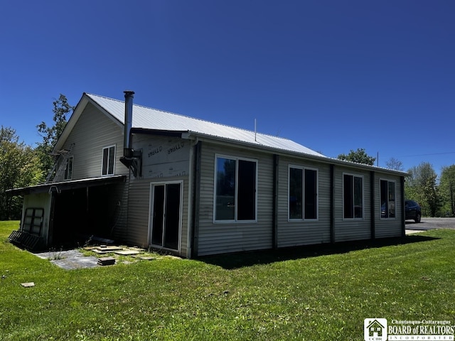 11604 York Rd, Hanover, NY 14136 - rear view of property with a yard and metal roof