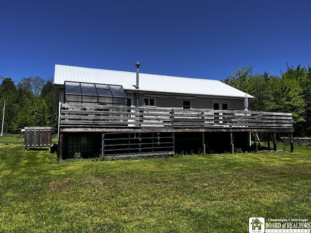 11604 York Rd, Hanover, NY 14136 - back of house with a lawn, a deck, and metal roof