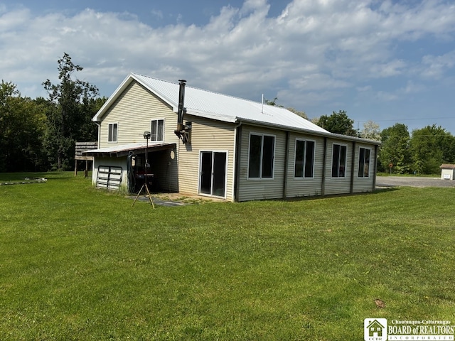11604 York Rd, Hanover, NY 14136 - back of property with a yard and metal roof