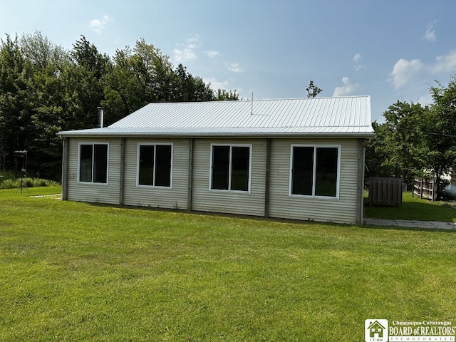 11604 York Rd, Hanover, NY 14136 - rear view of house featuring a lawn and metal roof