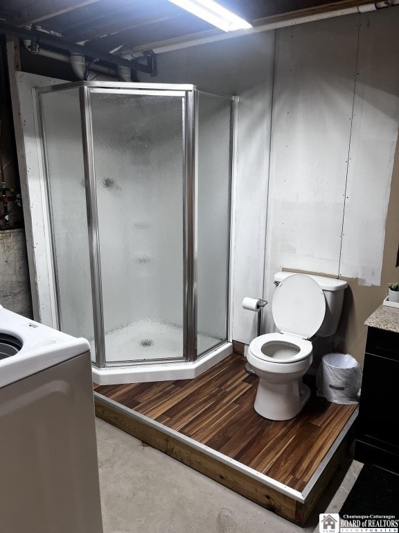 11604 York Rd, Hanover, NY 14136 - full bath featuring vanity, toilet, a shower stall, and concrete flooring