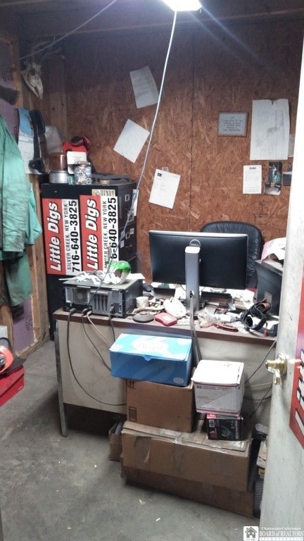11604 York Rd, Hanover, NY 14136 - office with unfinished concrete flooring and wooden walls