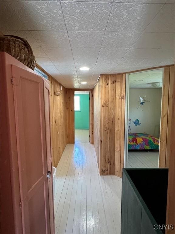2055 Fitzgerald Pt S, Otisco, NY 13110 - hall featuring light wood-style flooring and wood walls