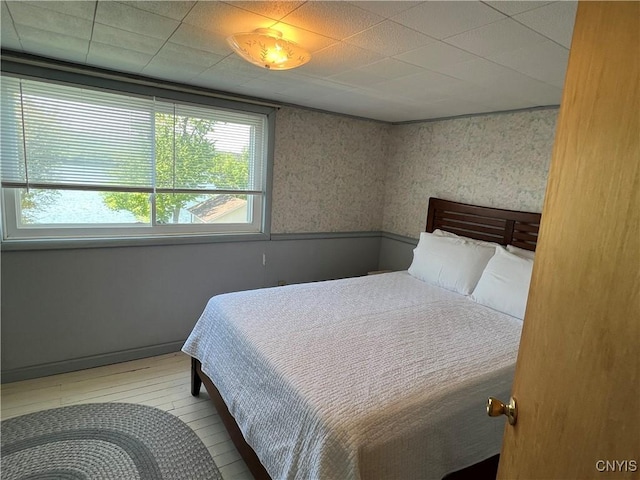 2055 Fitzgerald Pt S, Otisco, NY 13110 - bedroom featuring wood finished floors