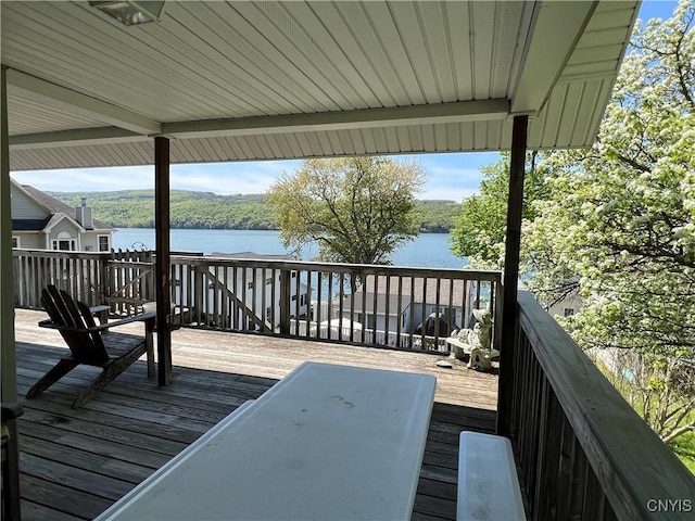 wooden deck featuring a water view