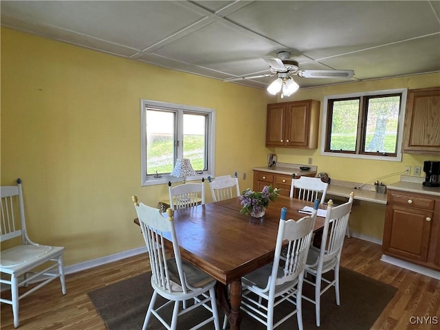 2055 Fitzgerald Pt S, Otisco, NY 13110 - dining space with dark wood-type flooring, plenty of natural light, and a ceiling fan