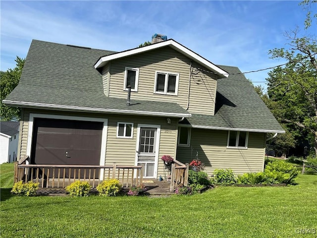 2055 Fitzgerald Pt S, Otisco, NY 13110 - rear view of house with a yard, a deck, a chimney, a garage, and a shingled roof