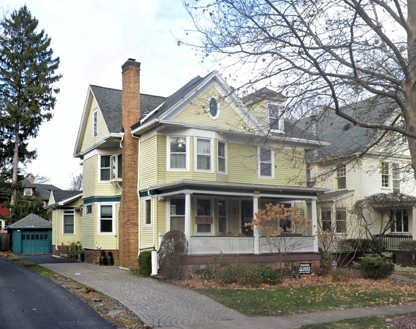 285 Westminster Rd, Rochester, NY 14607 - victorian house with covered porch, an outdoor structure, a chimney, and driveway