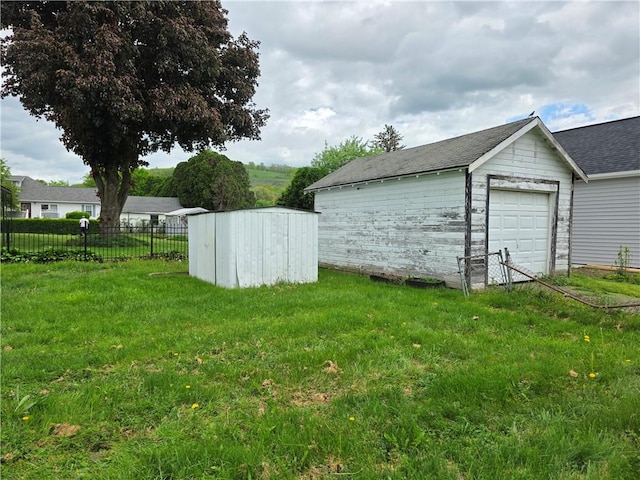 206 Pritchard Ave, Corning City, NY 14830 - detached garage featuring a storage shed