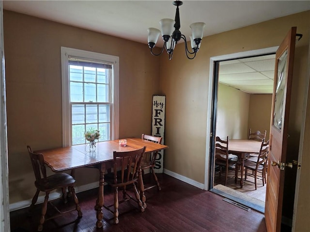 206 Pritchard Ave, Corning City, NY 14830 - dining area with wood finished floors, a chandelier, and baseboards