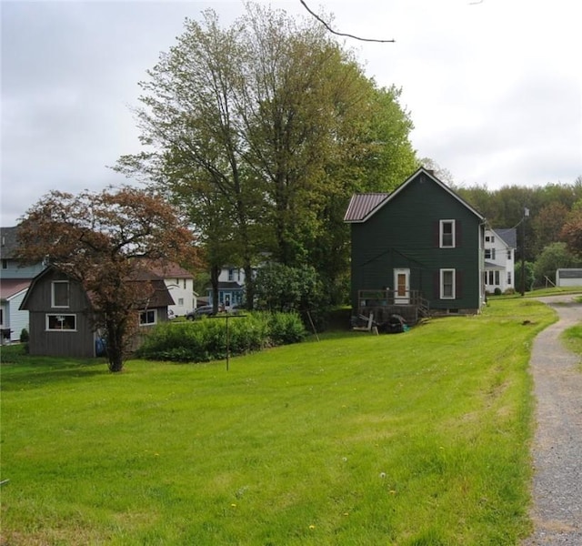 115 Lincoln St, Kane-Borough, PA 16735 - view of property exterior with a yard and metal roof