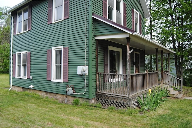 115 Lincoln St, Kane-Borough, PA 16735 - view of side of property with covered porch and a lawn
