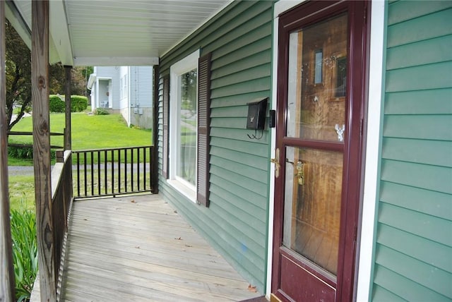 115 Lincoln St, Kane-Borough, PA 16735 - wooden terrace featuring covered porch and a lawn