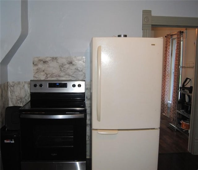 115 Lincoln St, Kane-Borough, PA 16735 - kitchen with freestanding refrigerator and black electric range oven