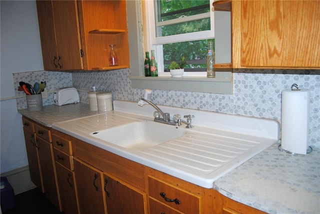 115 Lincoln St, Kane-Borough, PA 16735 - kitchen with open shelves, light countertops, brown cabinets, and backsplash