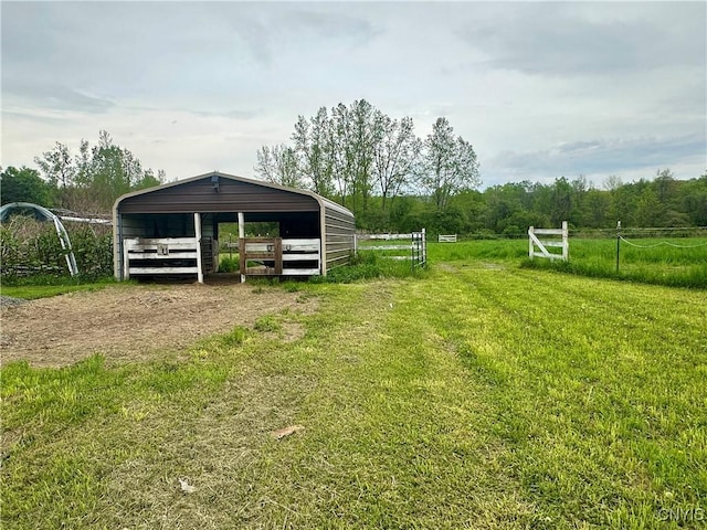 436 Mcgowan Rd, Frankfort, NY 13357 - view of yard with dirt driveway, a detached carport, and an outbuilding