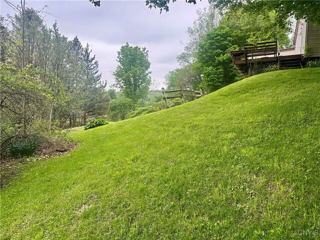 436 Mcgowan Rd, Frankfort, NY 13357 - view of grassy yard featuring a deck