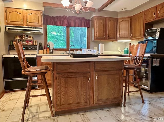 436 Mcgowan Rd, Frankfort, NY 13357 - kitchen with electric range oven, range hood, a chandelier, light countertops, and a kitchen island with sink
