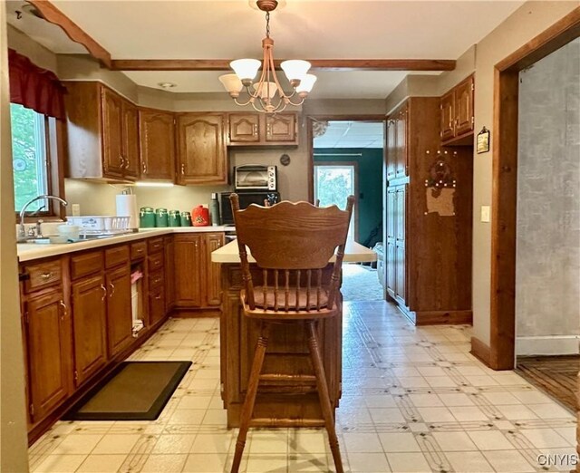 436 Mcgowan Rd, Frankfort, NY 13357 - kitchen featuring a chandelier, a sink, light countertops, and light floors
