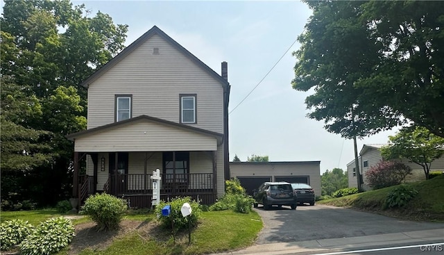 436 Mcgowan Rd, Frankfort, NY 13357 - view of front of home featuring a porch, a chimney, and a garage
