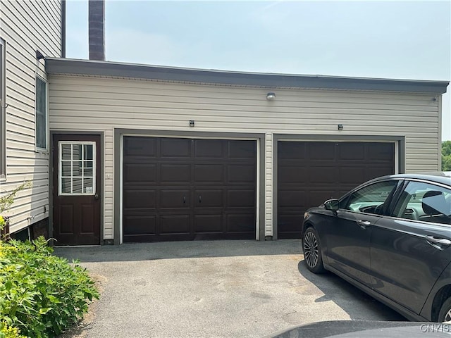 436 Mcgowan Rd, Frankfort, NY 13357 - garage with asphalt driveway