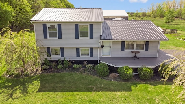 5904 Merrill Rd, Byron, NY 14422 - split level home featuring a front lawn, metal roof, and a deck