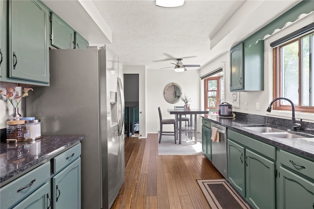 5904 Merrill Rd, Byron, NY 14422 - kitchen featuring green cabinets, a sink, stainless steel appliances, a textured ceiling, and ceiling fan