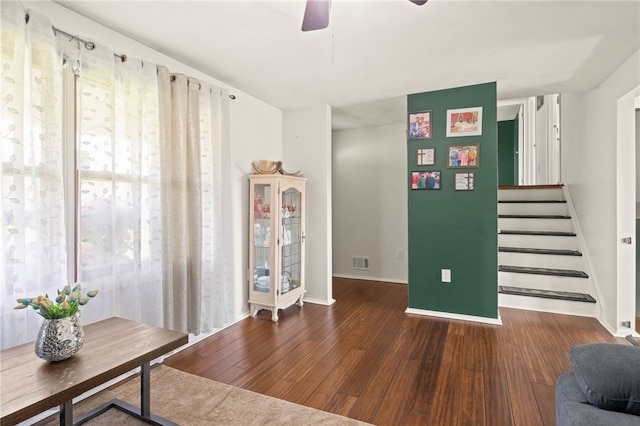 5904 Merrill Rd, Byron, NY 14422 - living room with wood finished floors, ceiling fan, baseboards, and stairs
