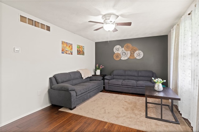 5904 Merrill Rd, Byron, NY 14422 - living room with ceiling fan, wood finished floors, baseboards, and an accent wall