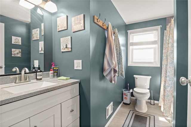 5904 Merrill Rd, Byron, NY 14422 - bathroom with toilet, vanity, baseboards, and wood finished floors