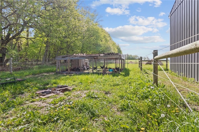 5904 Merrill Rd, Byron, NY 14422 - view of yard featuring fence, exterior structure, and an outbuilding