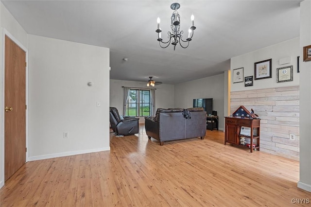 542 Lakeview Dr, Brownville, NY 13615 - living area with light wood-type flooring, a chandelier, and baseboards