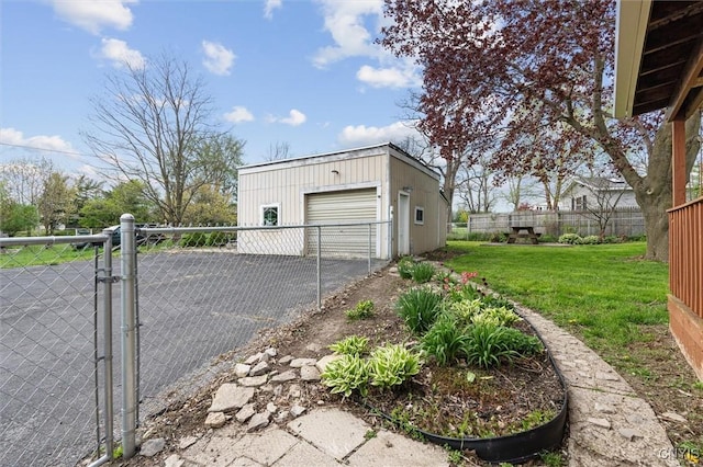 542 Lakeview Dr, Brownville, NY 13615 - view of home's exterior featuring a gate, an outbuilding, a garage, and asphalt driveway