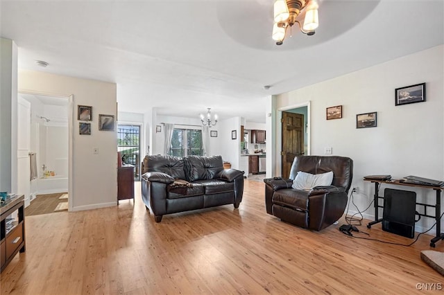 542 Lakeview Dr, Brownville, NY 13615 - living room with light wood finished floors, a chandelier, and a ceiling fan