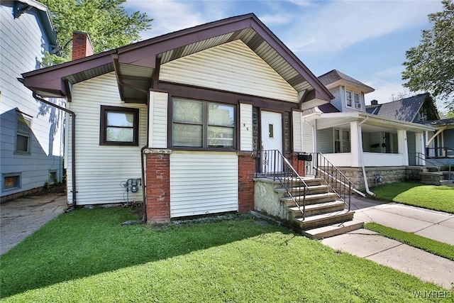 96 Winspear Ave, Buffalo, NY 14214 - view of front of house with a front lawn and a chimney