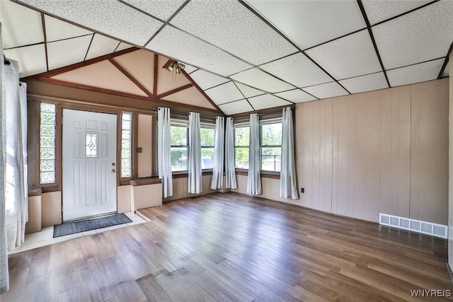 96 Winspear Ave, Buffalo, NY 14214 - foyer entrance featuring plenty of natural light, wood finished floors, vaulted ceiling, and wood walls