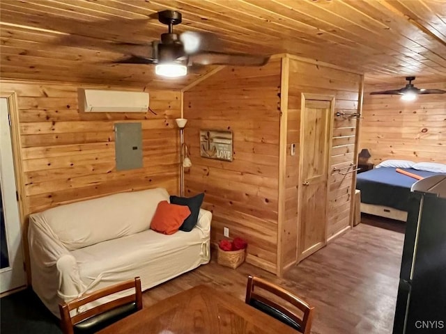 39498 Hyde Lake Rd, Theresa, NY 13691 - sitting room featuring a ceiling fan, electric panel, wooden ceiling, wood walls, and wood finished floors