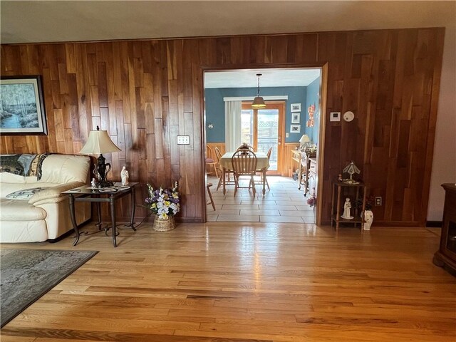 427 Church St, Winfield, NY 13491 - living room with wooden walls and light wood-style floors