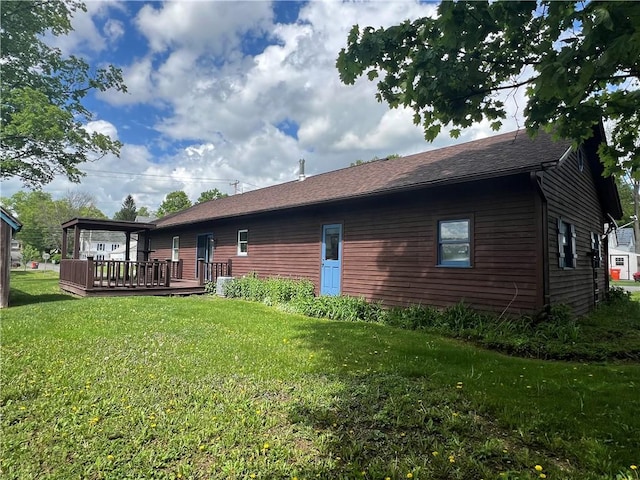 427 Church St, Winfield, NY 13491 - rear view of property with a deck and a yard