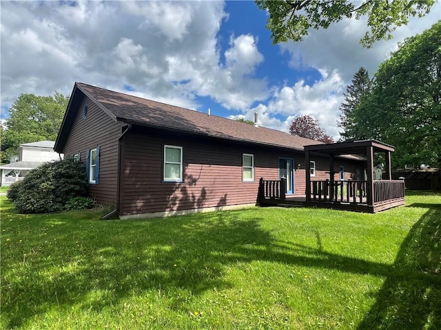 427 Church St, Winfield, NY 13491 - rear view of house featuring a deck, a yard, and a shingled roof