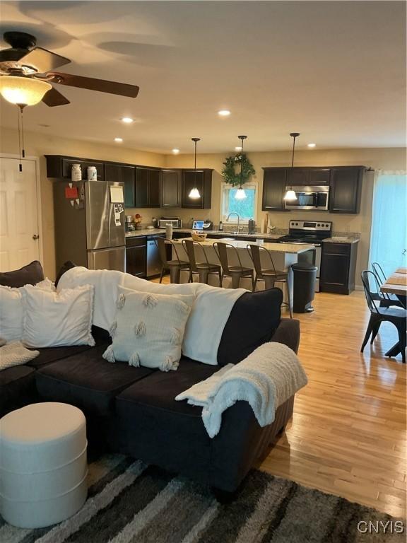 27892 Nys Rte 37, Pamelia, NY 13601 - living room featuring light wood-style floors, a ceiling fan, and recessed lighting