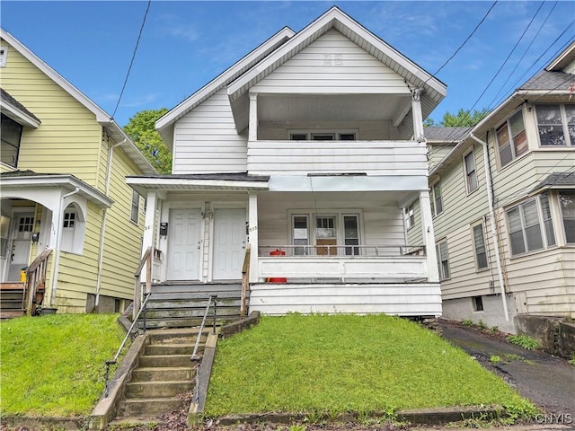 513 Tennyson Ave Unit 15, Syracuse, NY 13204 - view of front of home featuring covered porch, a balcony, and a front yard