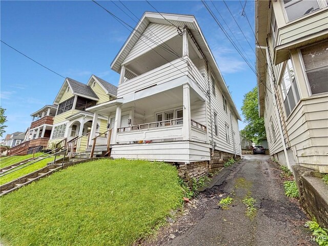 513 Tennyson Ave Unit 15, Syracuse, NY 13204 - view of front of property featuring a porch and a front lawn