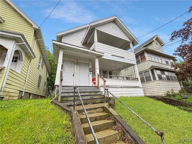 513 Tennyson Ave Unit 15, Syracuse, NY 13204 - view of front of home with a front lawn and covered porch
